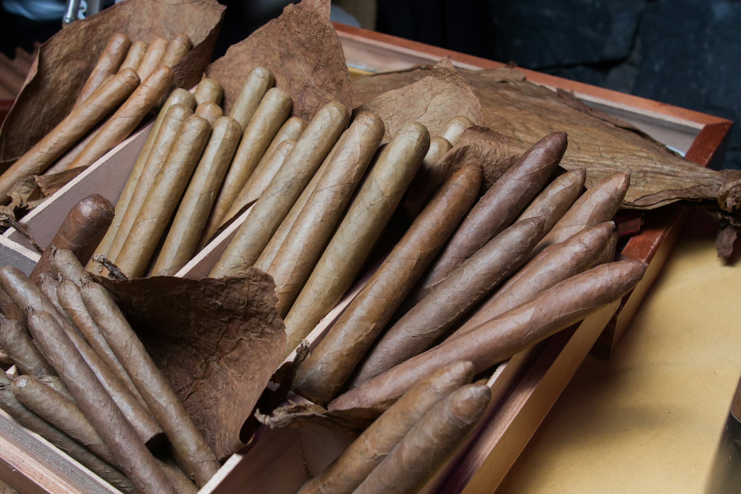 Cigars beside a scale—weight of the roll, not of the nicotine.