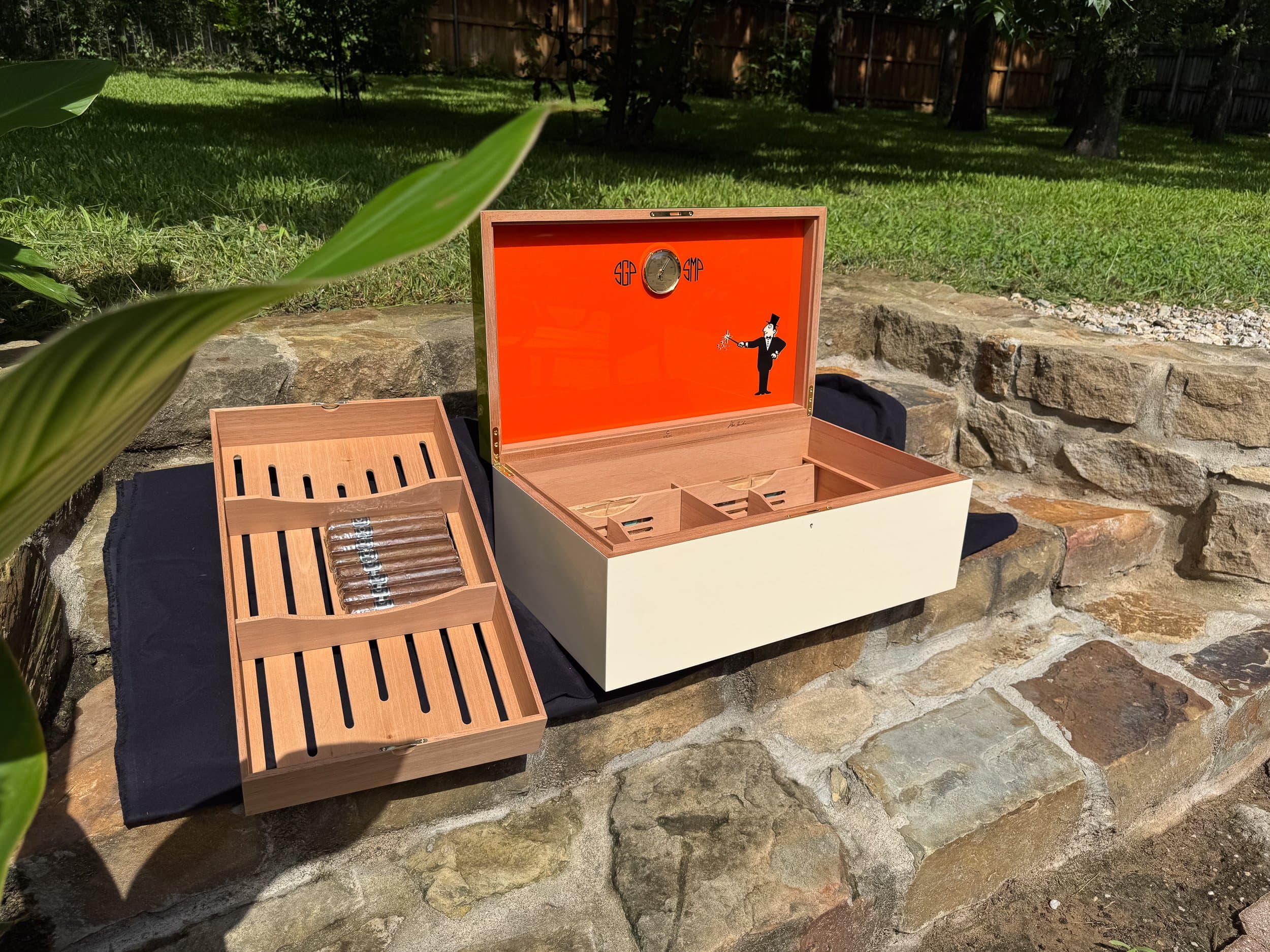 The Orangerie: centient luxury avocado green orange humidor open tray removed outdoor