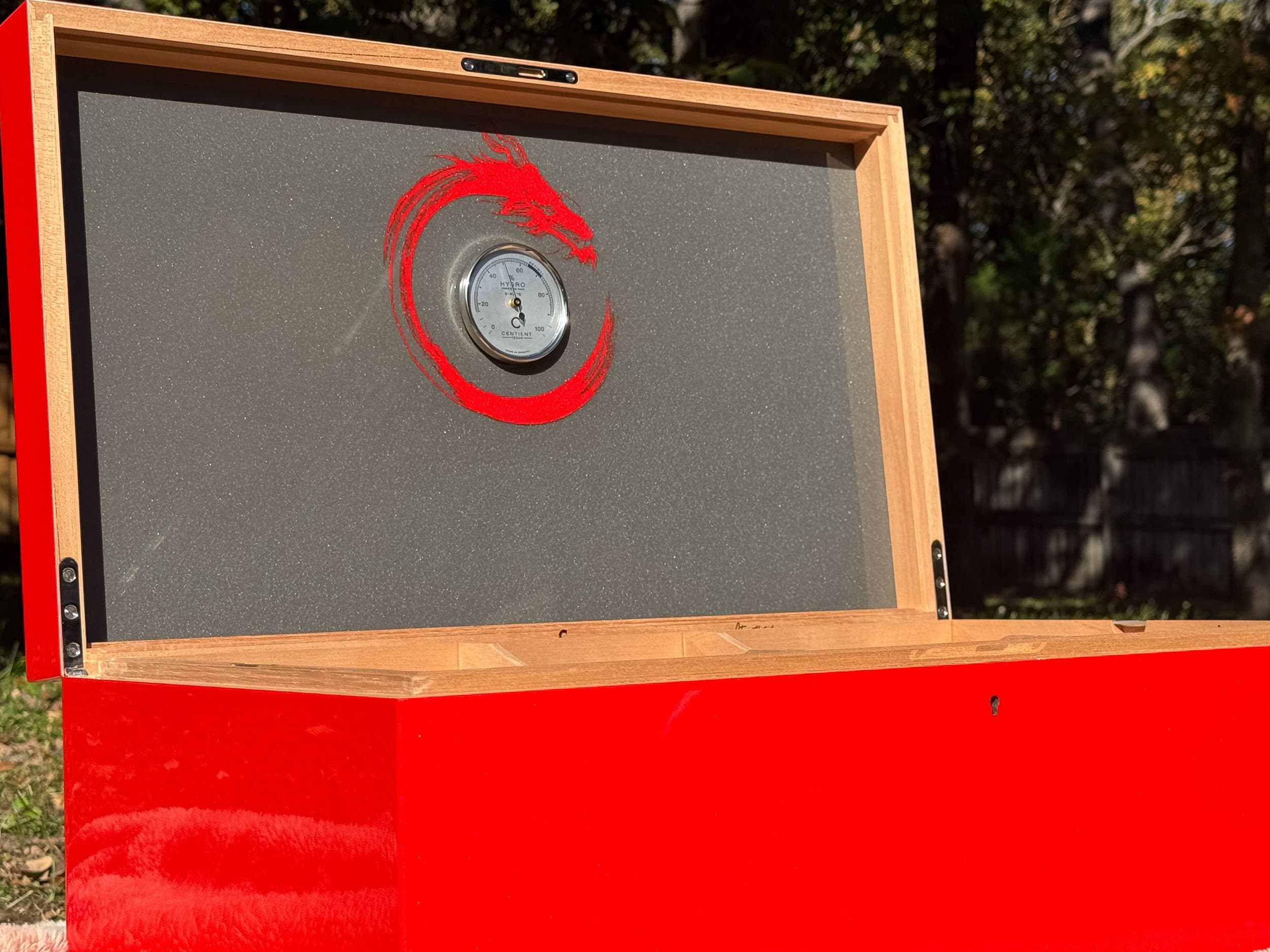 The Draconis: centient red dragon humidor inside metallic lid