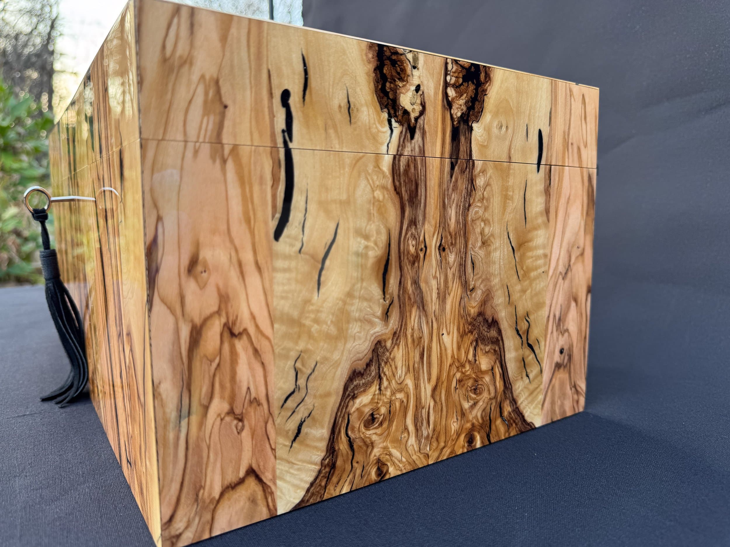 The Bethlehem: centient luxury bethlehem olivewood humidor right side angled grain detail