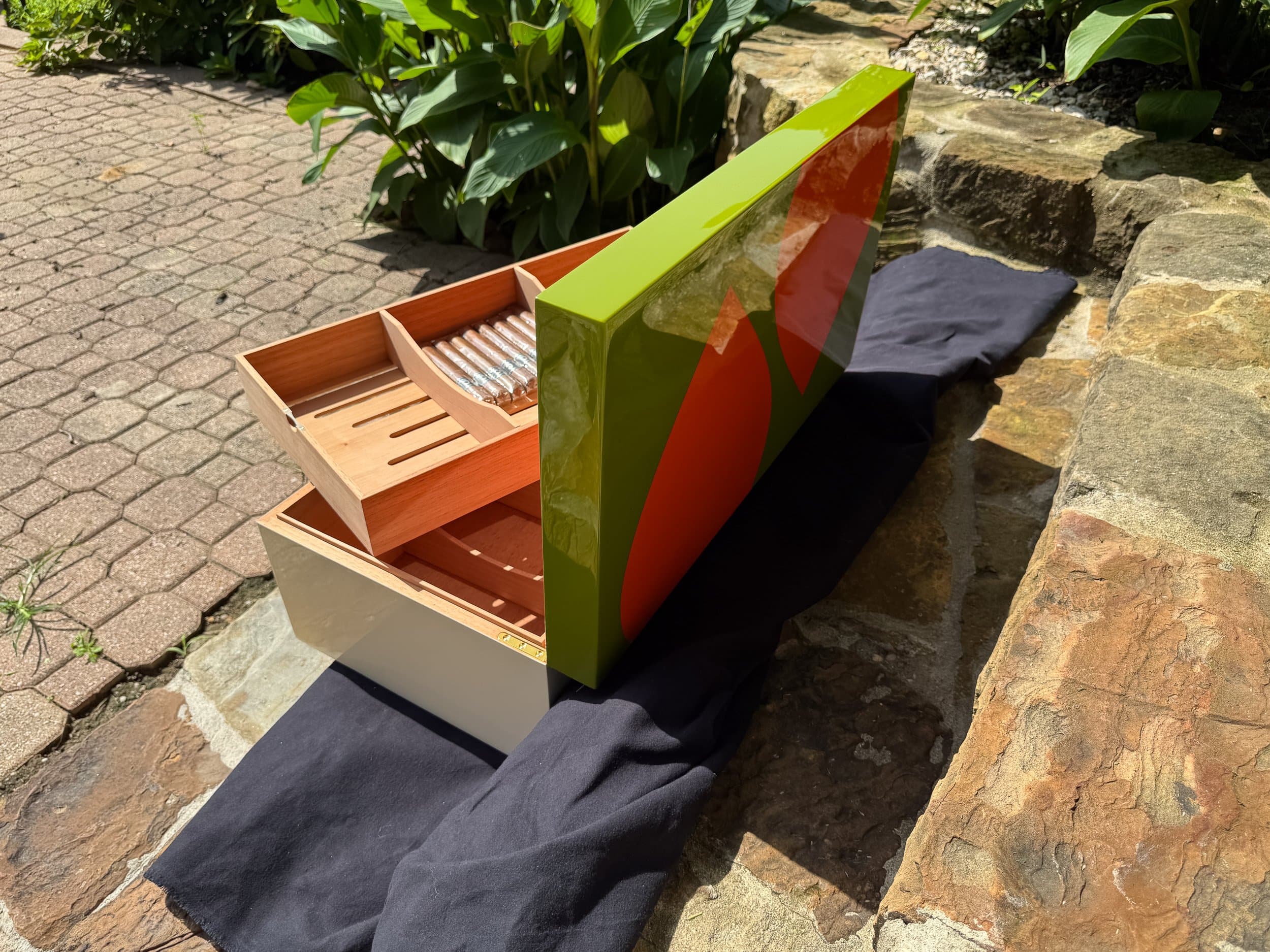 The Orangerie: centient luxury avocado green orange humidor open side outdoor