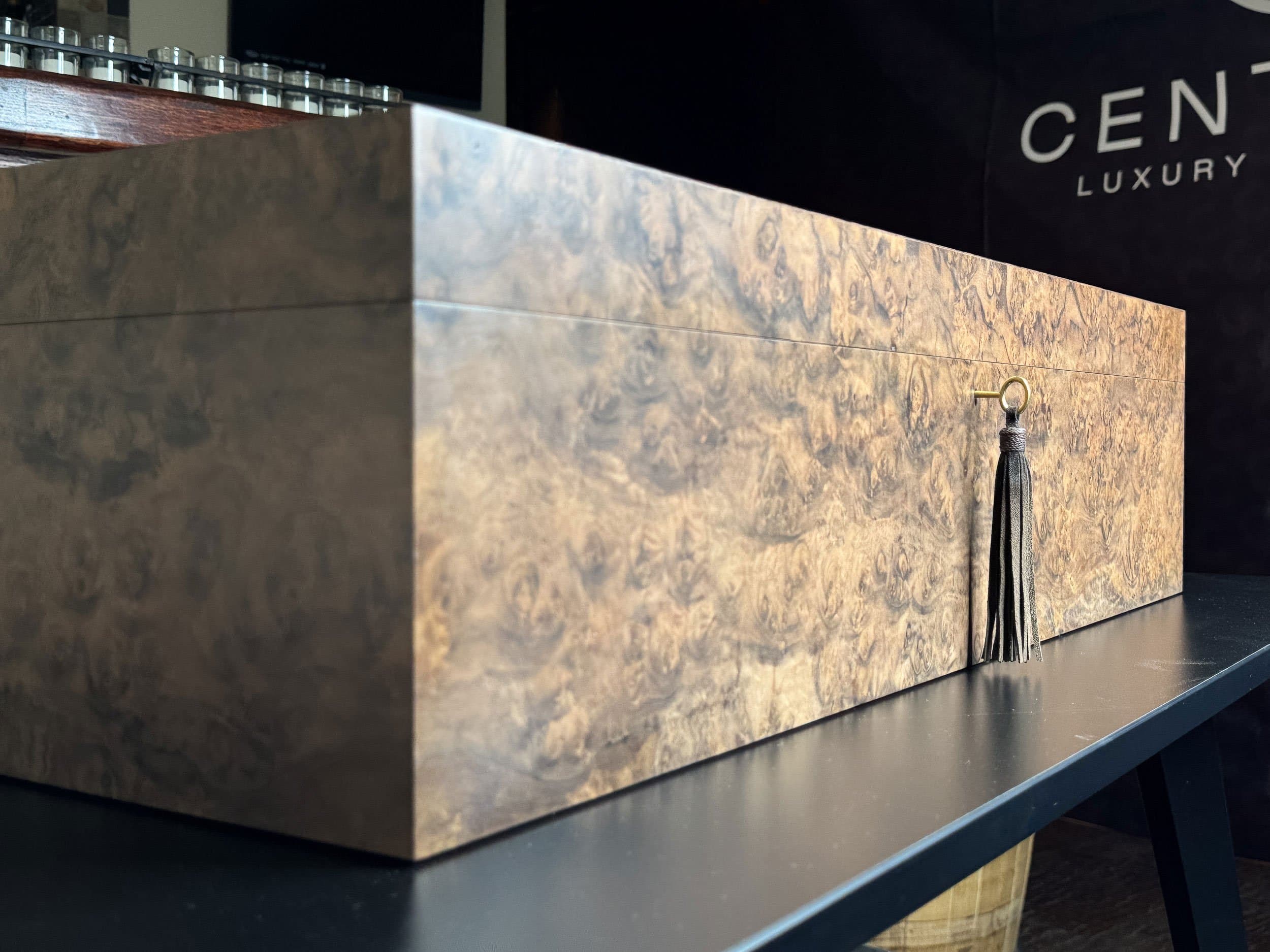 The Vitrine: centient luxury walnut burl museum glass humidor front angle key tassel