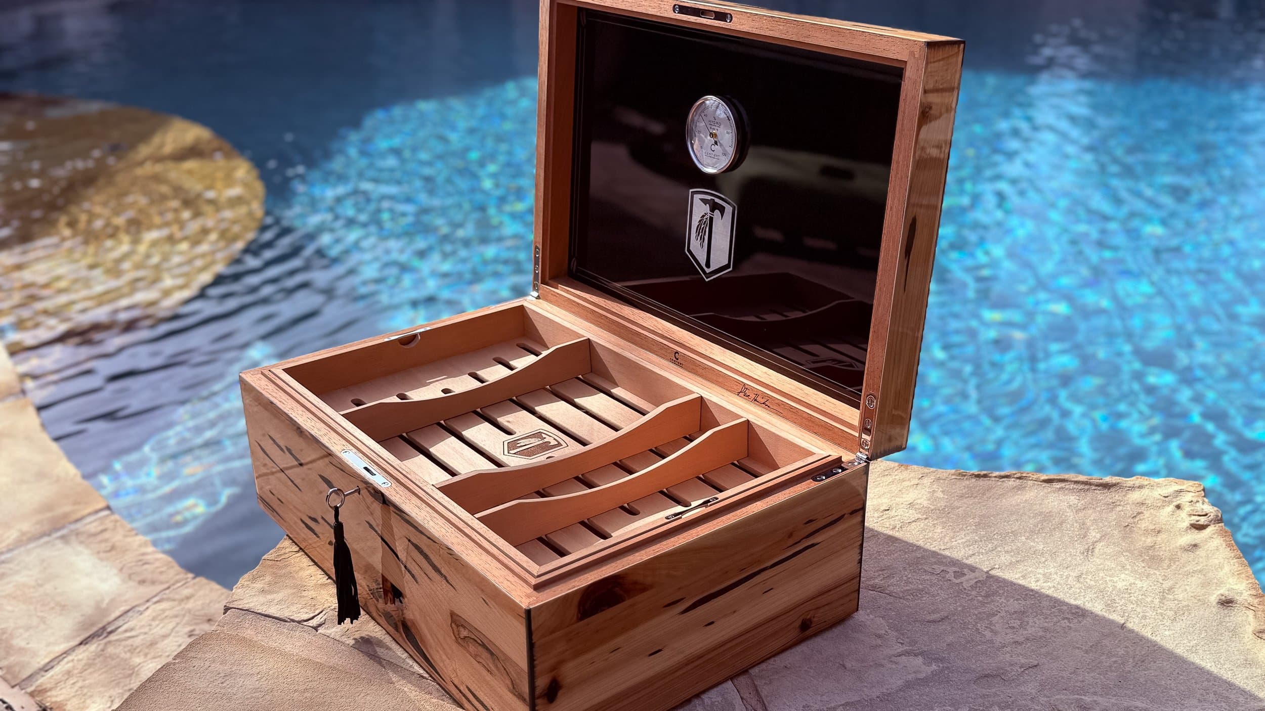 The Cypress — Blackline: entient luxury pecky cypress humidor open poolside