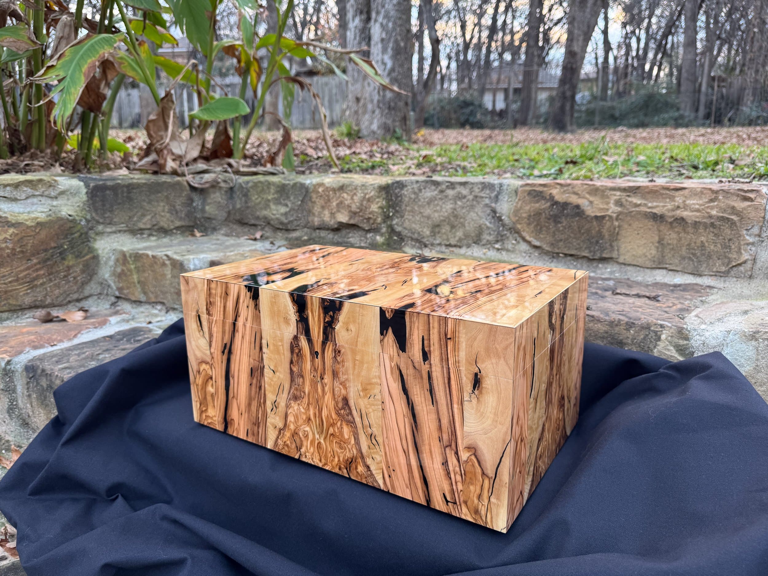 The Bethlehem: centient luxury bethlehem olivewood humidor exterior closed grain hero